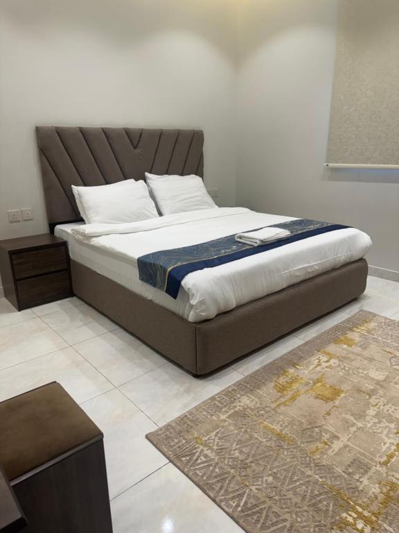 Postel nebo postele na pokoji v ubytování New Time Apartments