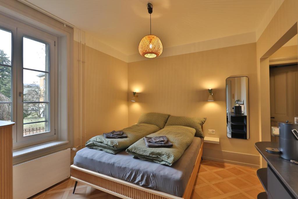 Postel nebo postele na pokoji v ubytování Union Lodge Berna