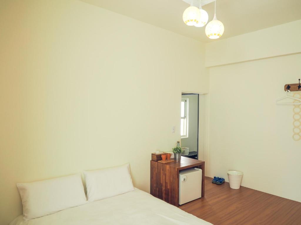 Postel nebo postele na pokoji v ubytování Mumu Inn