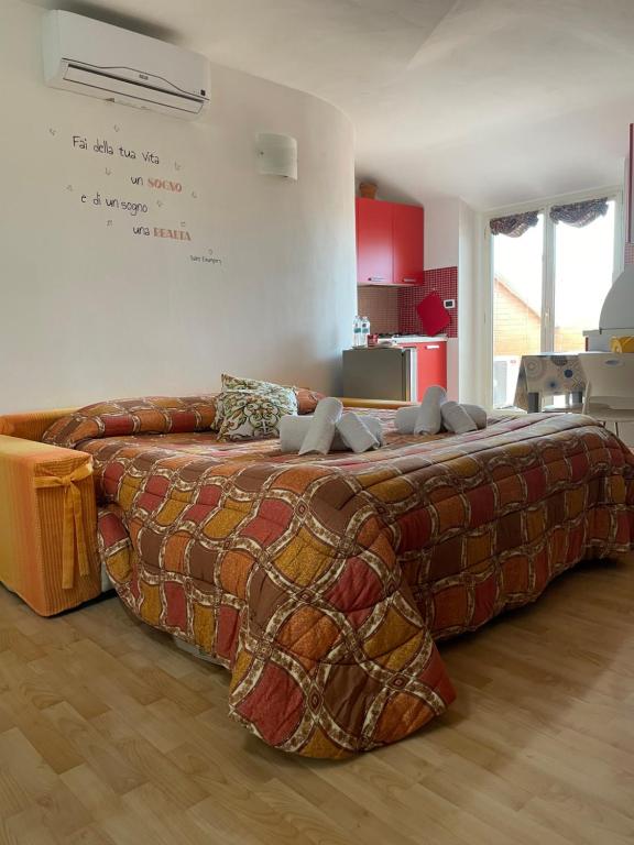 Кровать или кровати в номере Monolocale ad uso ESCLUSIVO