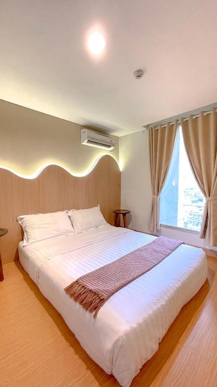 Ένα ή περισσότερα κρεβάτια σε δωμάτιο στο Kyoto Home 京都 2BR - 53 Sqm at Downtown Semarang