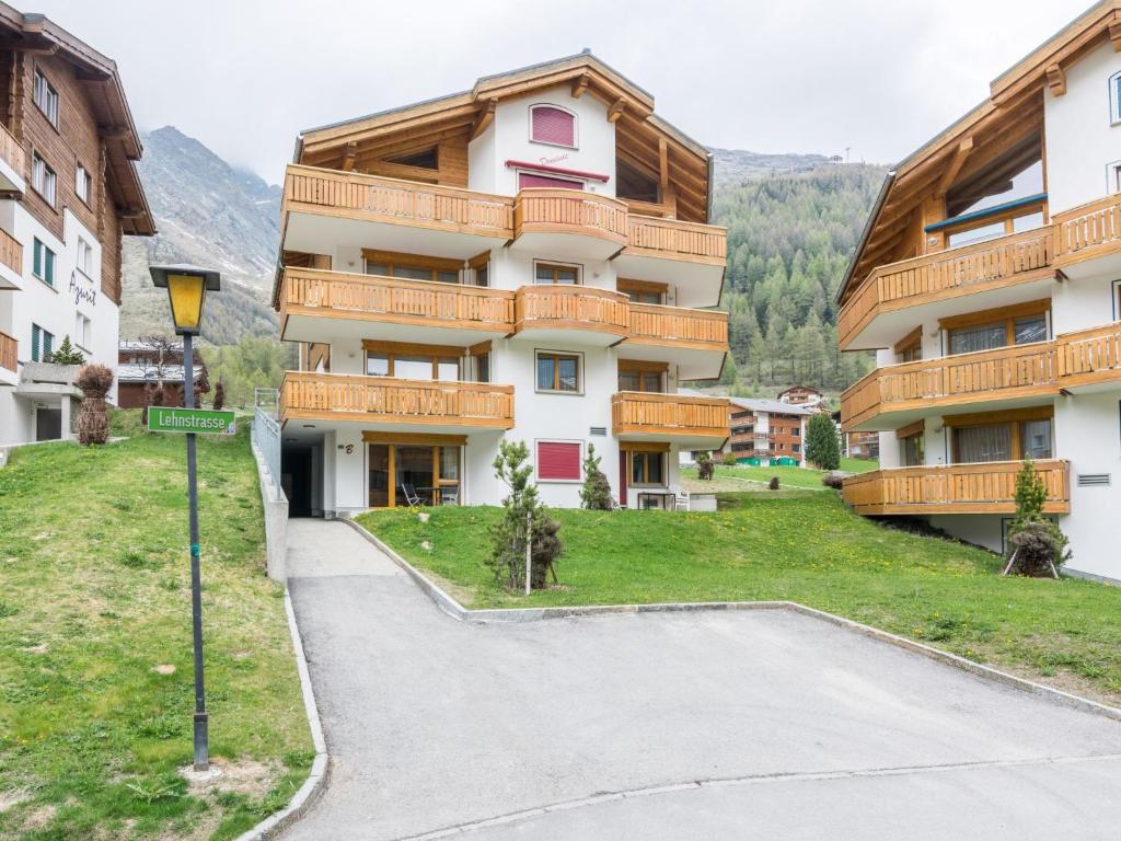 a building with a street sign in front of it at Apartment Dominic B2 by Interhome in Saas-Fee