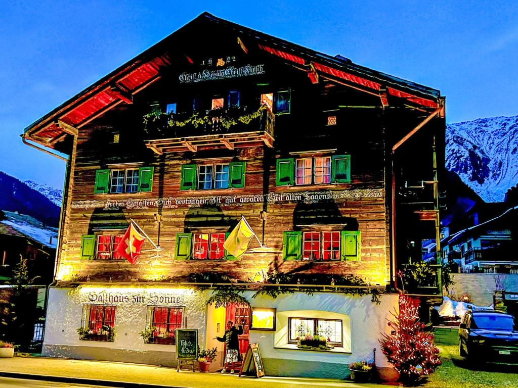 a house with christmas lights on the side of it at Apartment Steinbock-Stube by Interhome in Klosters