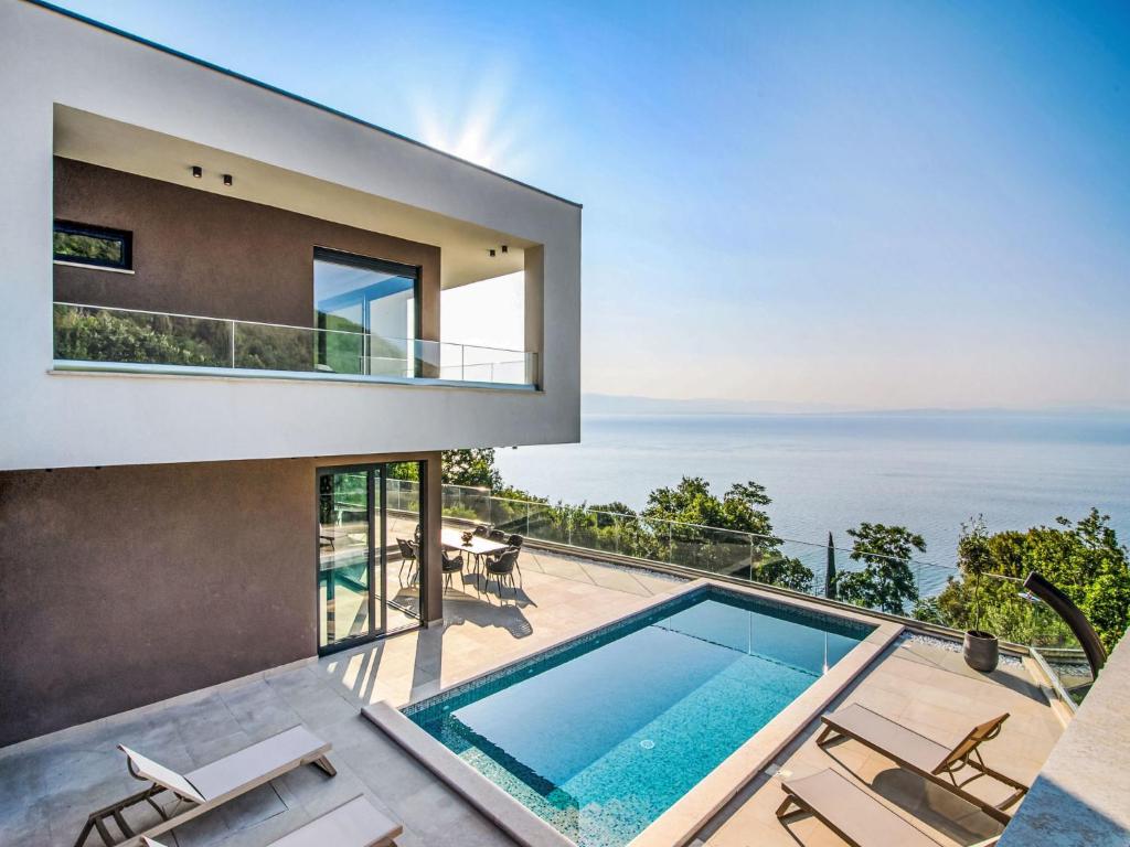a house with a view of the ocean at Villa Marmonte by Interhome in Lovran