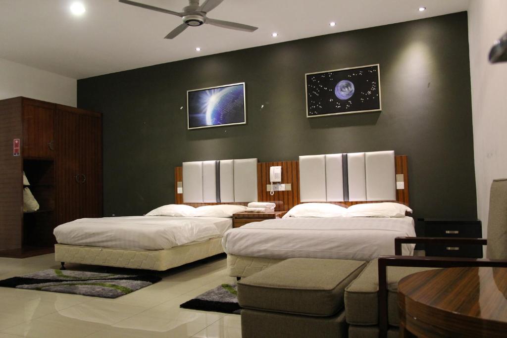 Postel nebo postele na pokoji v ubytování M Design Hotel @ Seri Kembangan