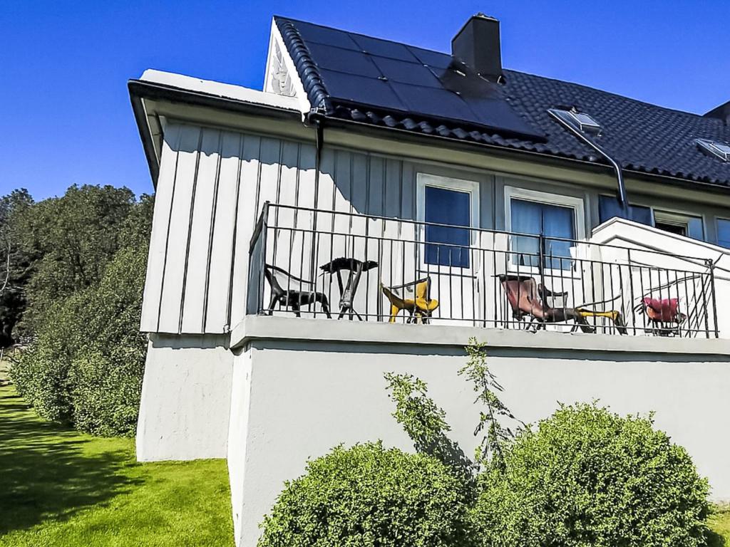 a house with a solar panel on the balcony at Apartment Samlen Vasselgård by Interhome in Herand