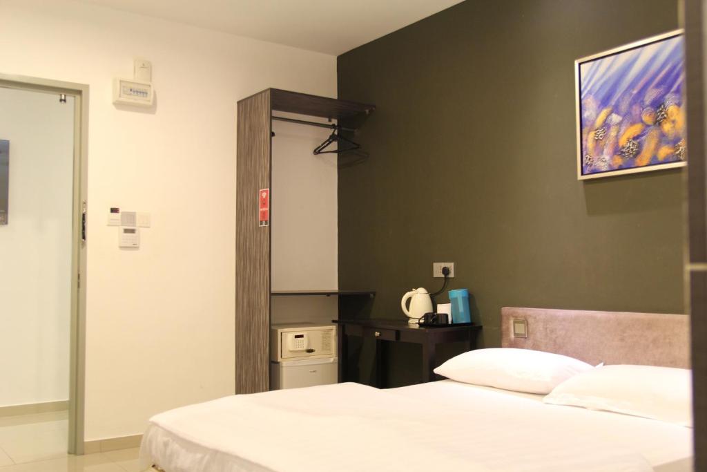 Postel nebo postele na pokoji v ubytování M Design Hotel @ Seri Kembangan