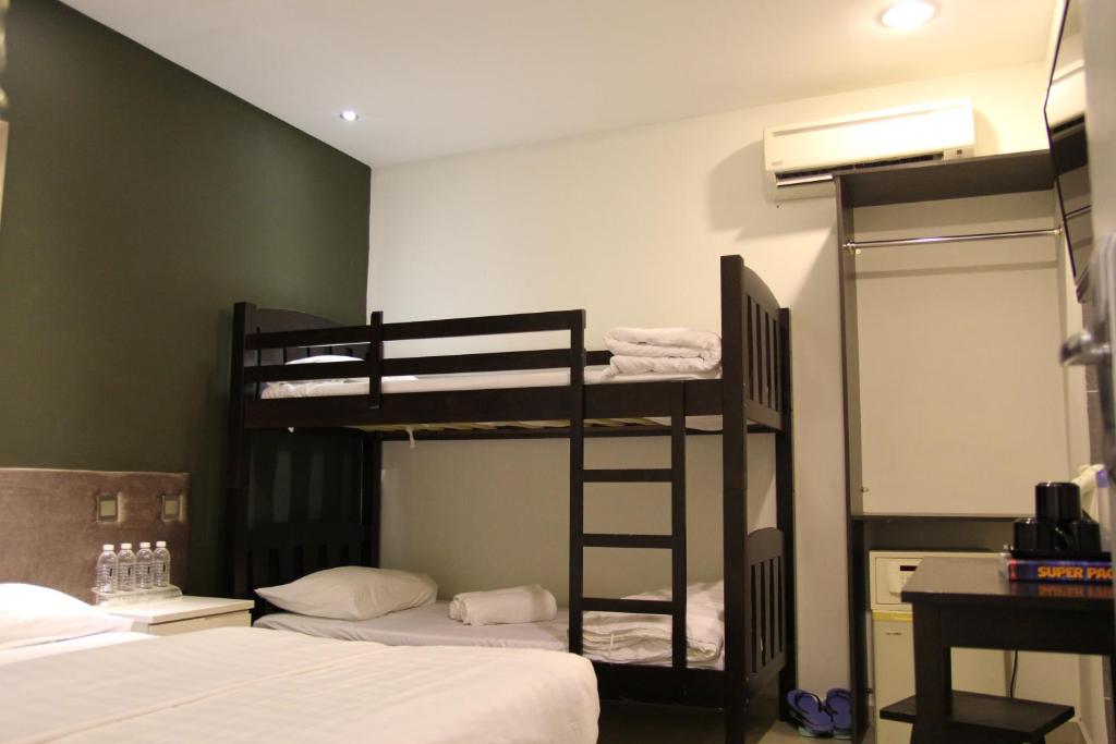 Postel nebo postele na pokoji v ubytování M Design Hotel @ Seri Kembangan