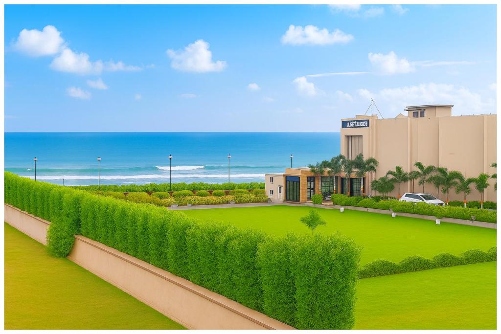 a rendering of a hedge fence in front of a building at Hotel JK Seaside Inn Near Jagannath Temple - Fully Air Conditioning Deluxe Room - Free Wifie and Parking - Rooftop Sea View Hotel In Puri in Puri