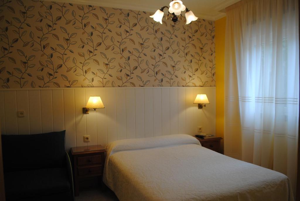 Posteľ alebo postele v izbe v ubytovaní Hostal Santa Marta Playa