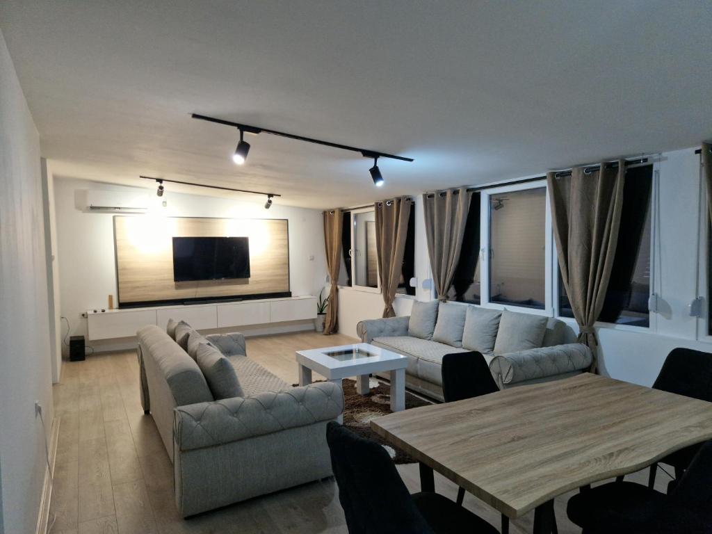 a living room with a couch and a table at Diamond Apartment 2-Luxury in Strumica