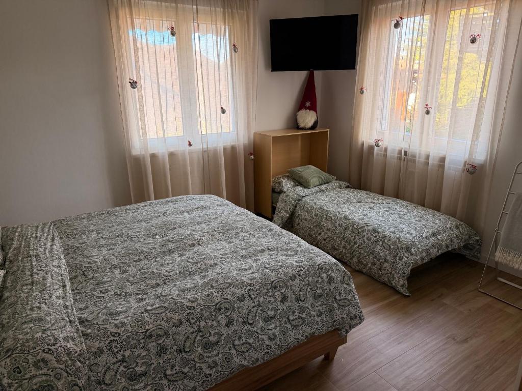 Postel nebo postele na pokoji v ubytování Riki House Selvino