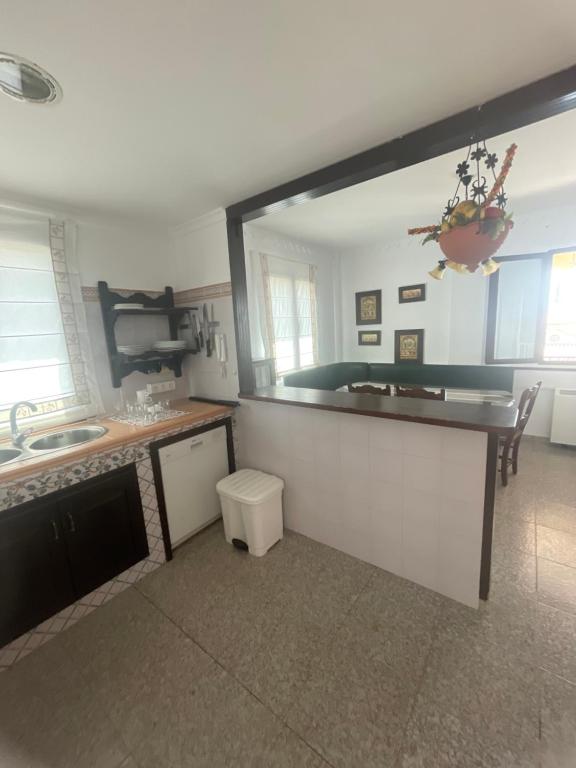 a kitchen with a sink and a counter top at Villa Familia in Écija