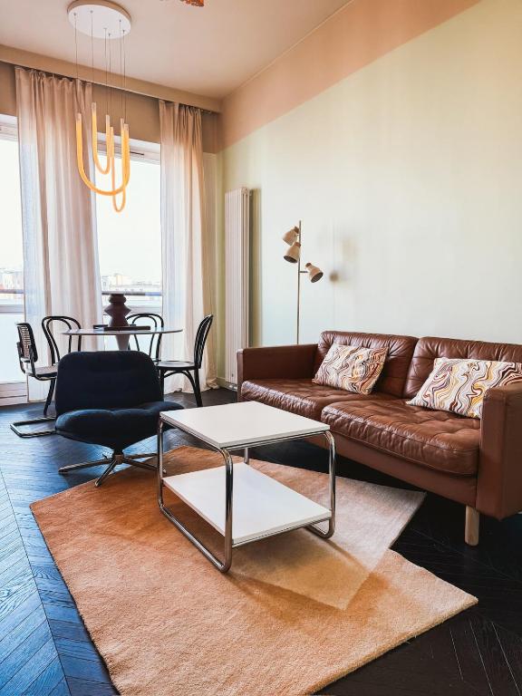 a living room with a couch and a table at JTB Apartamenty Centrum in Szczecin