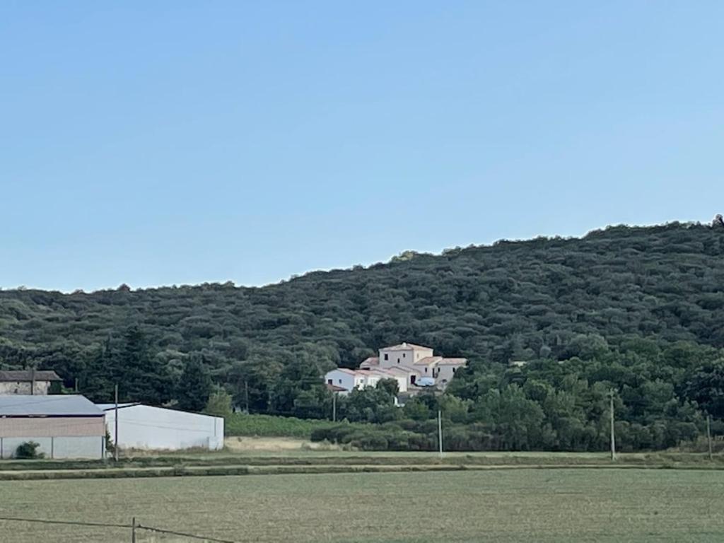 a large house on top of a hill at Gîte du Courbier in Saint-Montan