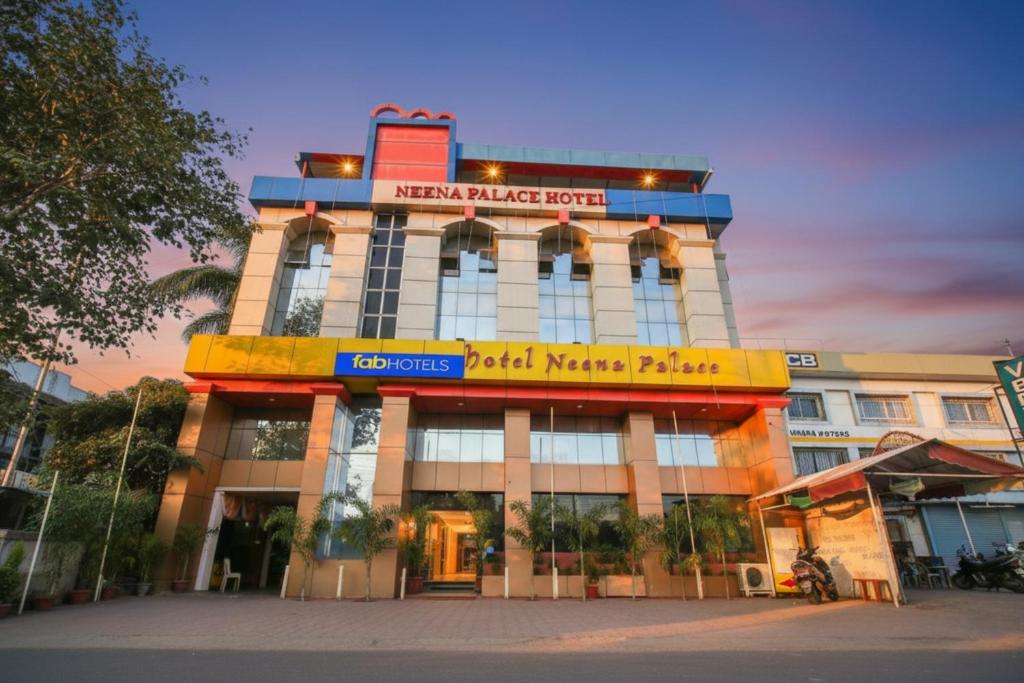 a building with a sign on the front of it at FabHotel Neena Palace in Bhopal