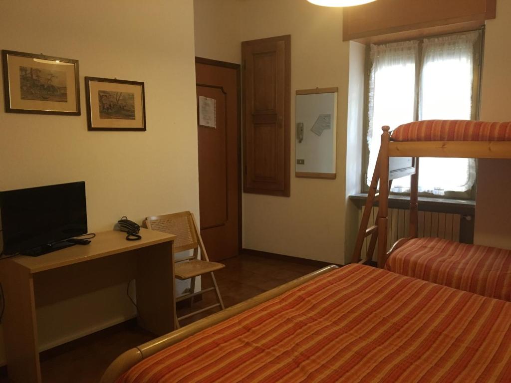 Łóżko lub łóżka w pokoju w obiekcie Hotel Americana