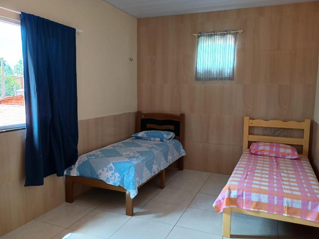 Ένα ή περισσότερα κρεβάτια σε δωμάτιο στο Casa Gamas MB