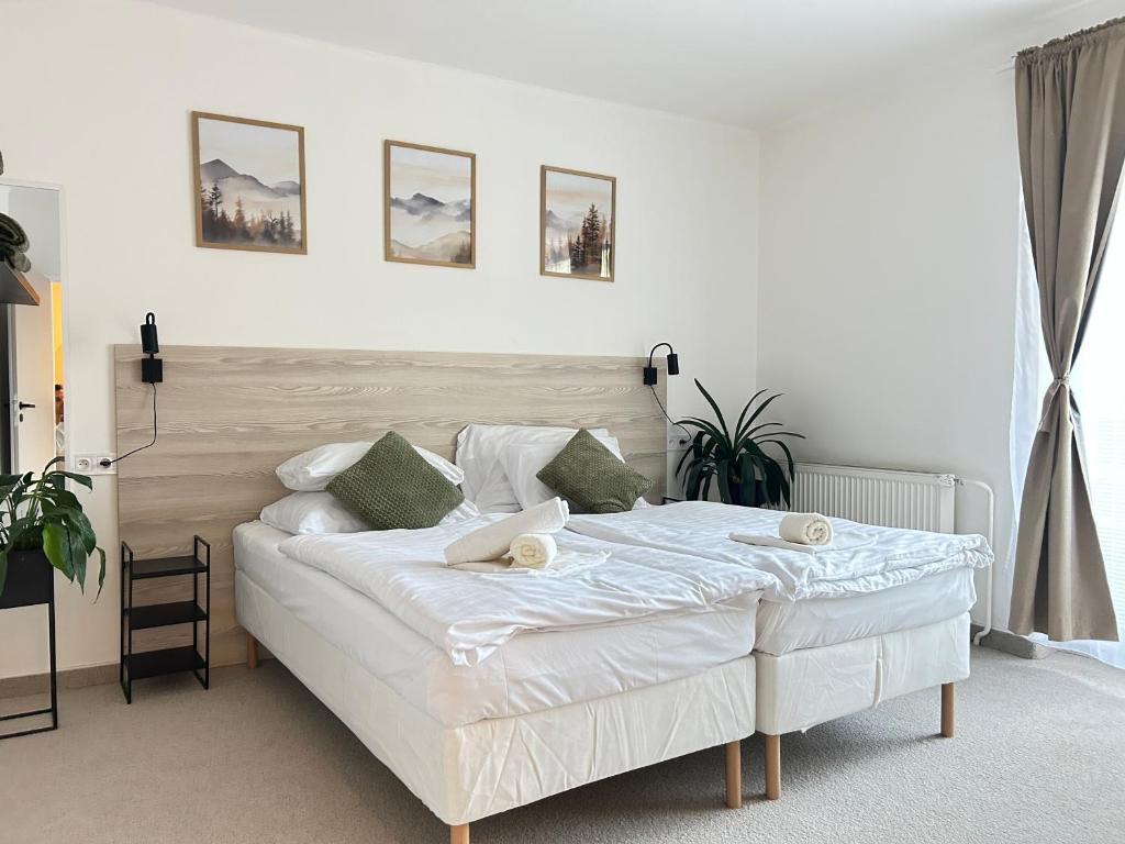 Postel nebo postele na pokoji v ubytování Hotel Sport Houštka