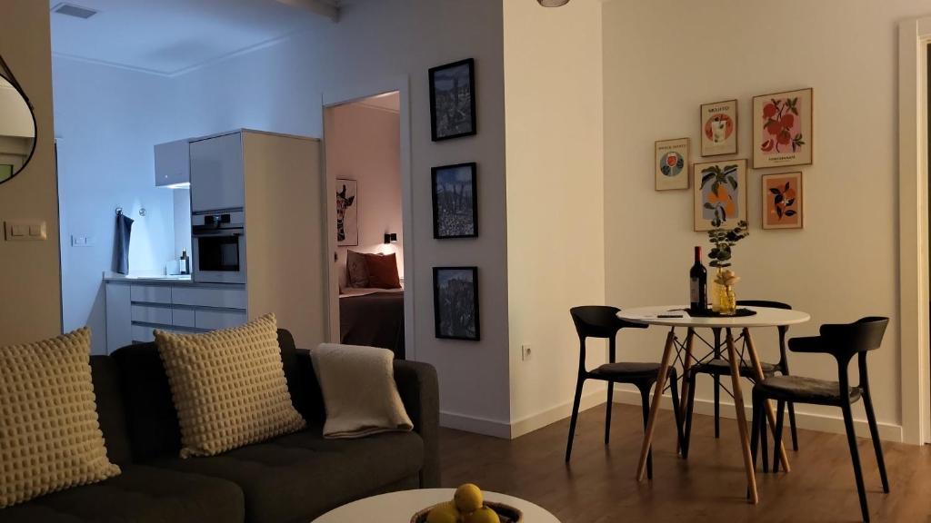 a living room with a couch and a table at La Esquina in Denia