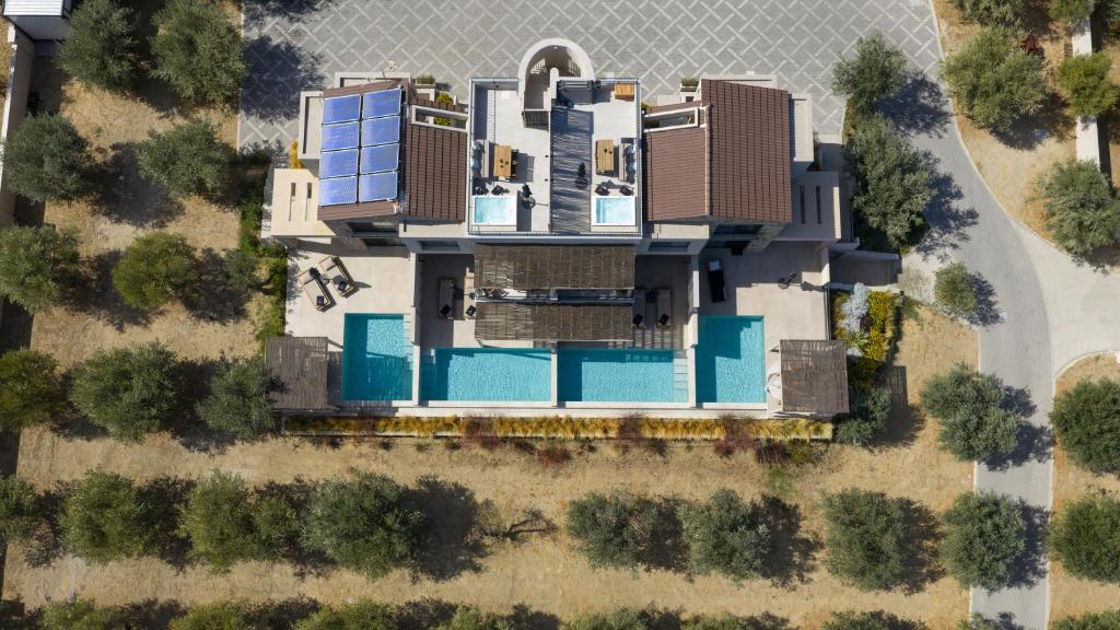 an aerial view of a house with a pool at Olivera Suites Sarti in Sarti