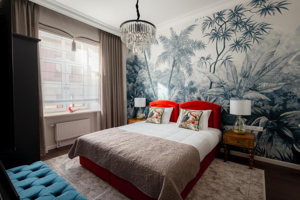 Ένα ή περισσότερα κρεβάτια σε δωμάτιο στο Piotrkowska 89 Residence