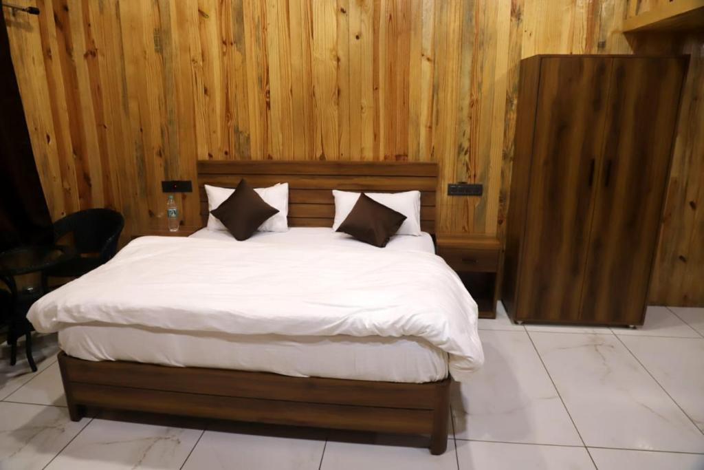 Ένα ή περισσότερα κρεβάτια σε δωμάτιο στο Tiger Woods