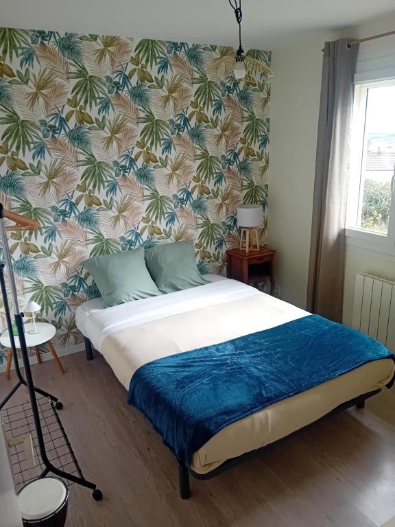 Ένα ή περισσότερα κρεβάτια σε δωμάτιο στο Chez Séba