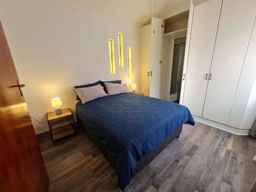 Кровать или кровати в номере BLISS Cottage Langenhovenpark