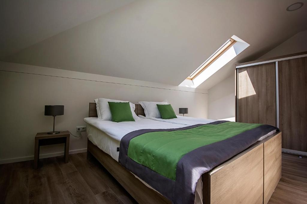 Postel nebo postele na pokoji v ubytování Enjoy Apartments