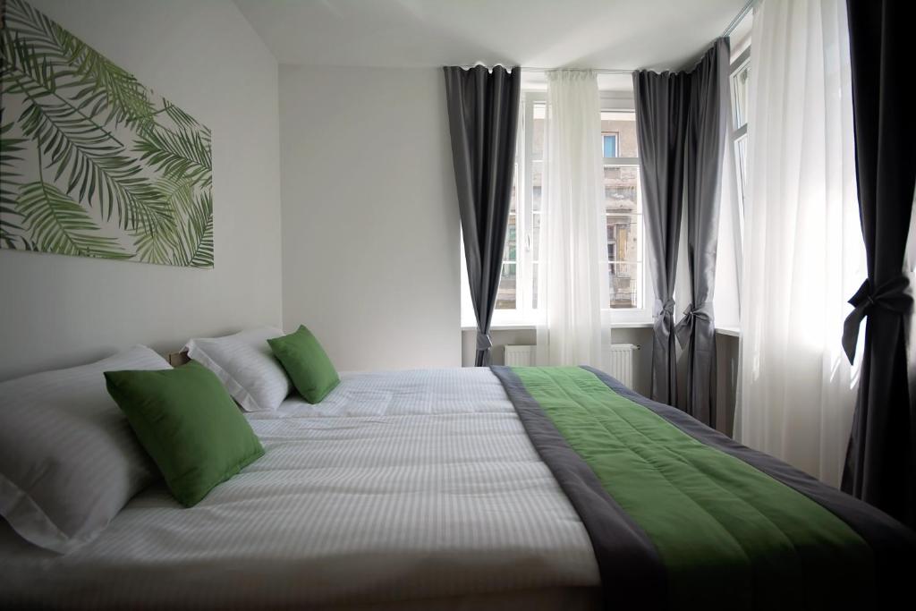 Postel nebo postele na pokoji v ubytování Enjoy Apartments
