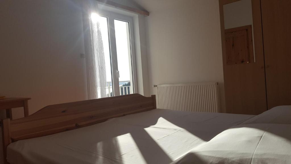 Postel nebo postele na pokoji v ubytování Guesthouse Bosankic