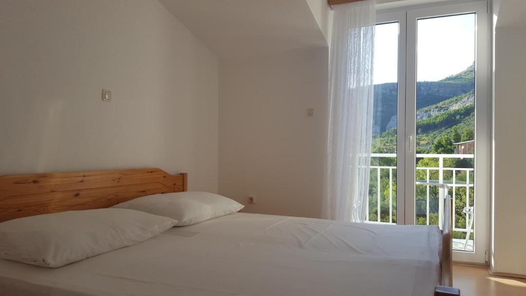 Postel nebo postele na pokoji v ubytování Guesthouse Bosankic