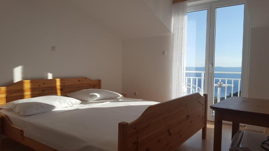 Postel nebo postele na pokoji v ubytování Guesthouse Bosankic