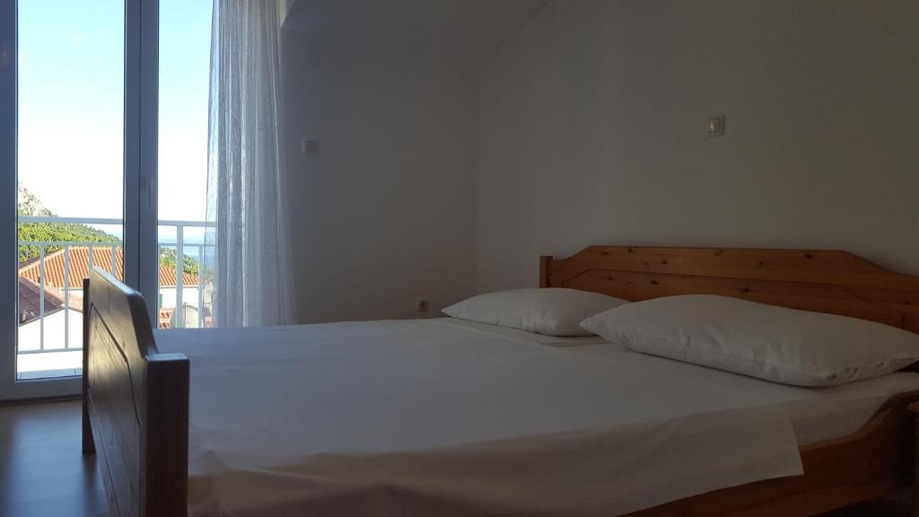 Postel nebo postele na pokoji v ubytování Guesthouse Bosankic