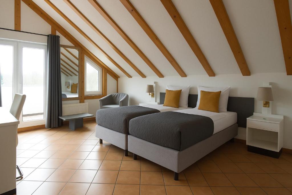 Ένα ή περισσότερα κρεβάτια σε δωμάτιο στο Stay Smart Giessen Hotel und Appartments