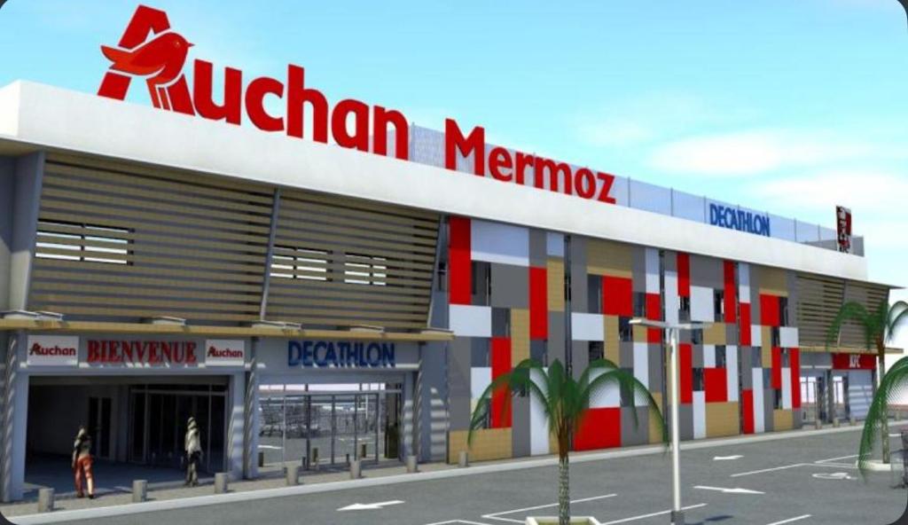 a rendering of a shopping center with a kruttenham memory sign on top at Keur Ébène - Appartement Cosy à Ouakam Batrain in Dakar