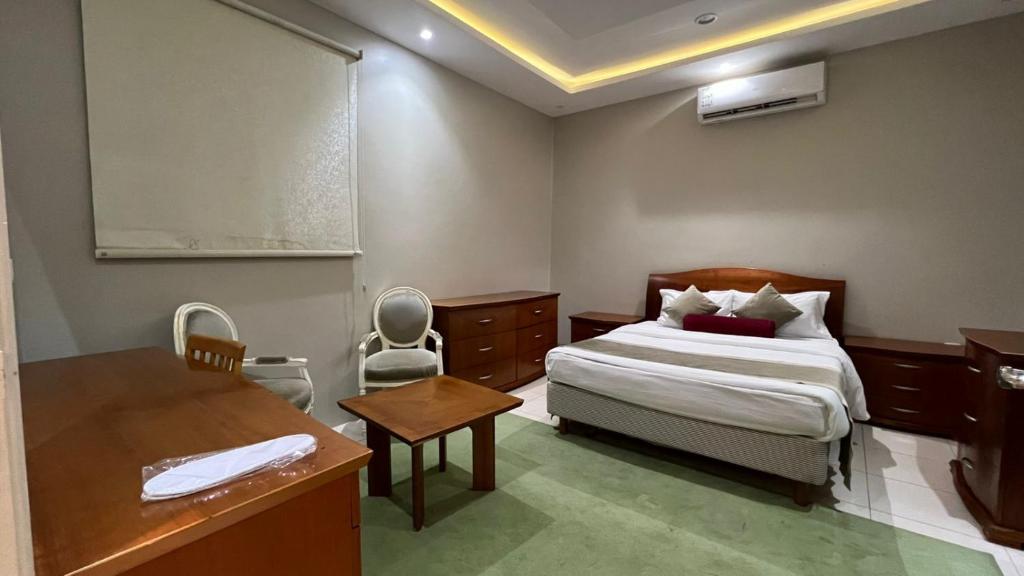 Postel nebo postele na pokoji v ubytování شقق واحة بيروت