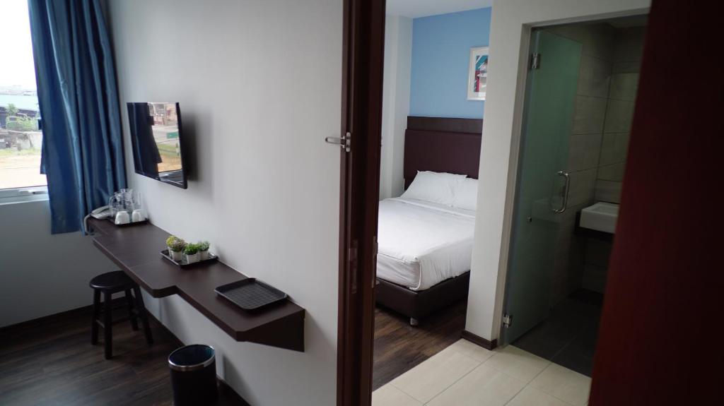 Postel nebo postele na pokoji v ubytování Hotel Cascada