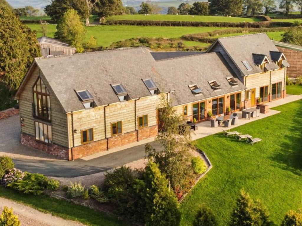 an aerial view of a large house with a yard at Bedw Barn in Newtown