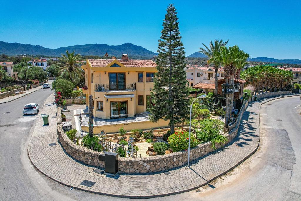 a house with a garden in the middle of a street at Villa Dunya in Kyrenia