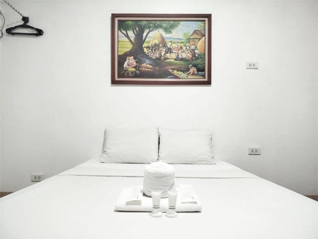 Giường trong phòng chung tại Sulit Budget Hotel VMapa