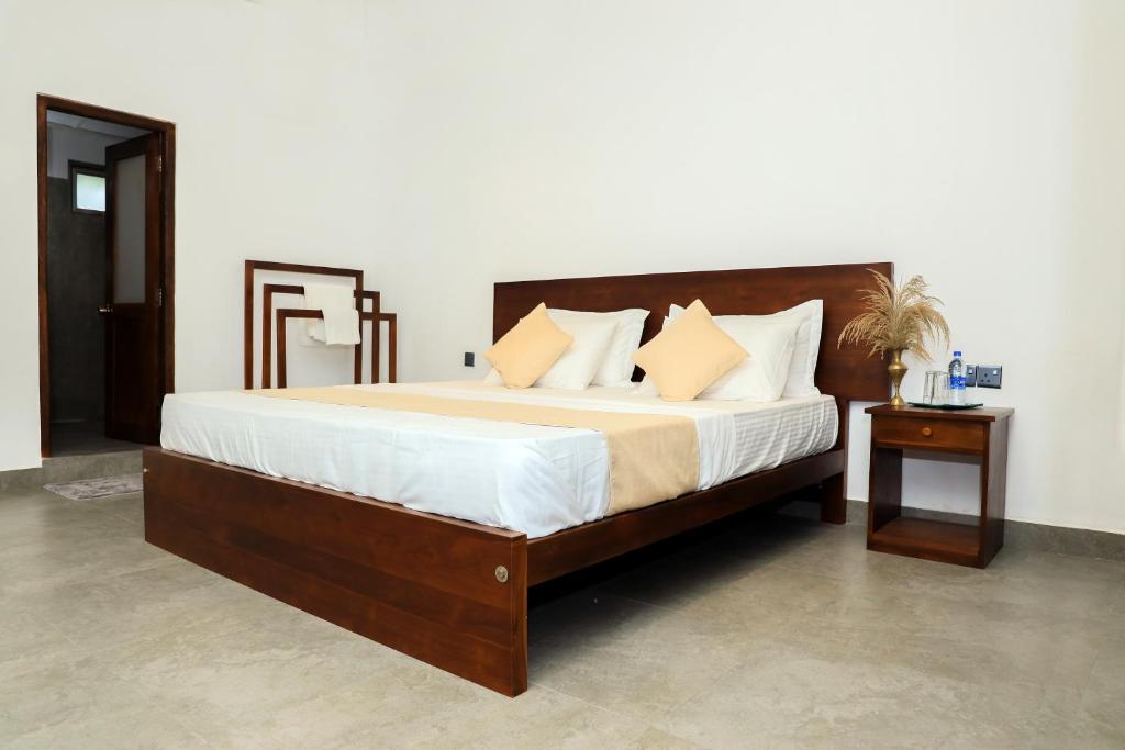 Postel nebo postele na pokoji v ubytování Elephant Trail Homestay