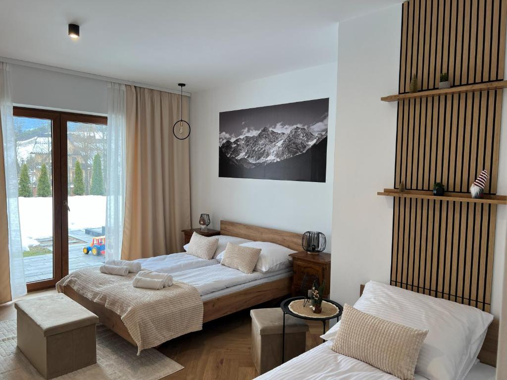 En eller flere senge i et værelse på Apartament Kryształowy Potok
