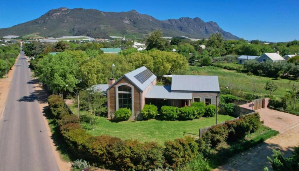 an aerial view of a house with a road at Winelands Manor Vineyard Views in Riebeek-Kasteel