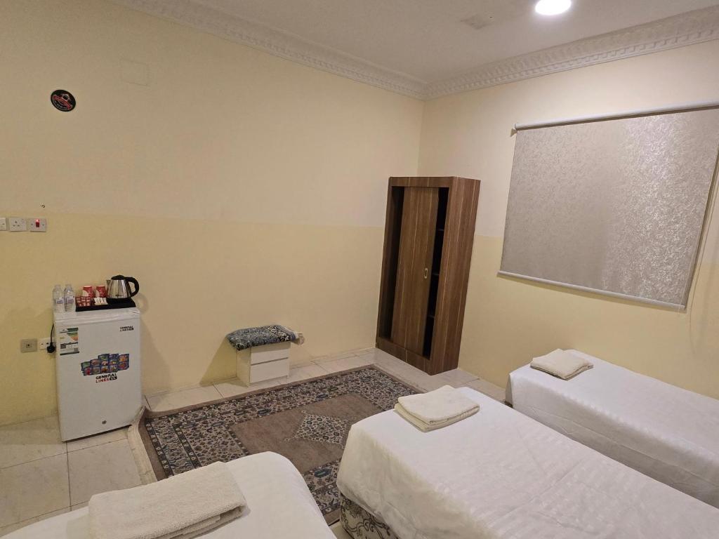 Una cama o camas en una habitación de دار الرضا Dar Al Reda