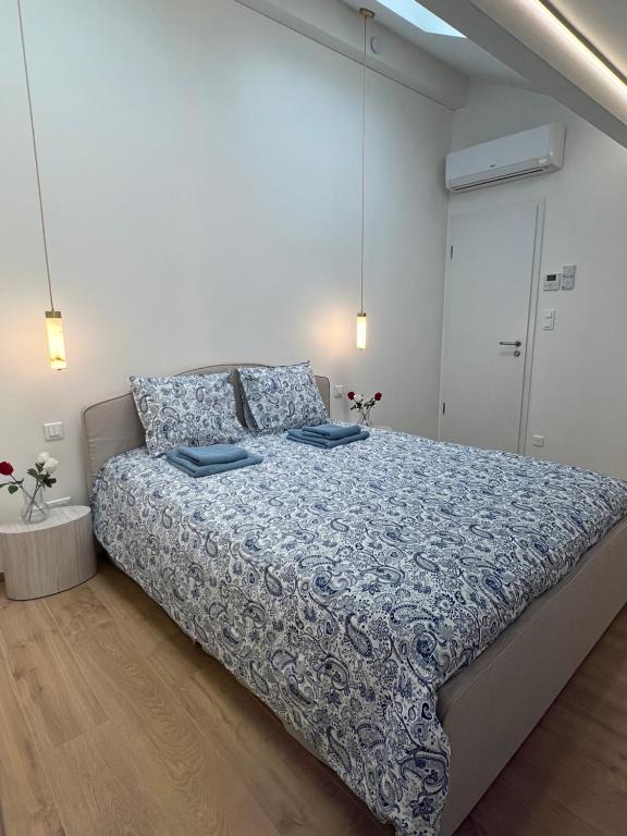 En eller flere senge i et værelse på Résidence Nova