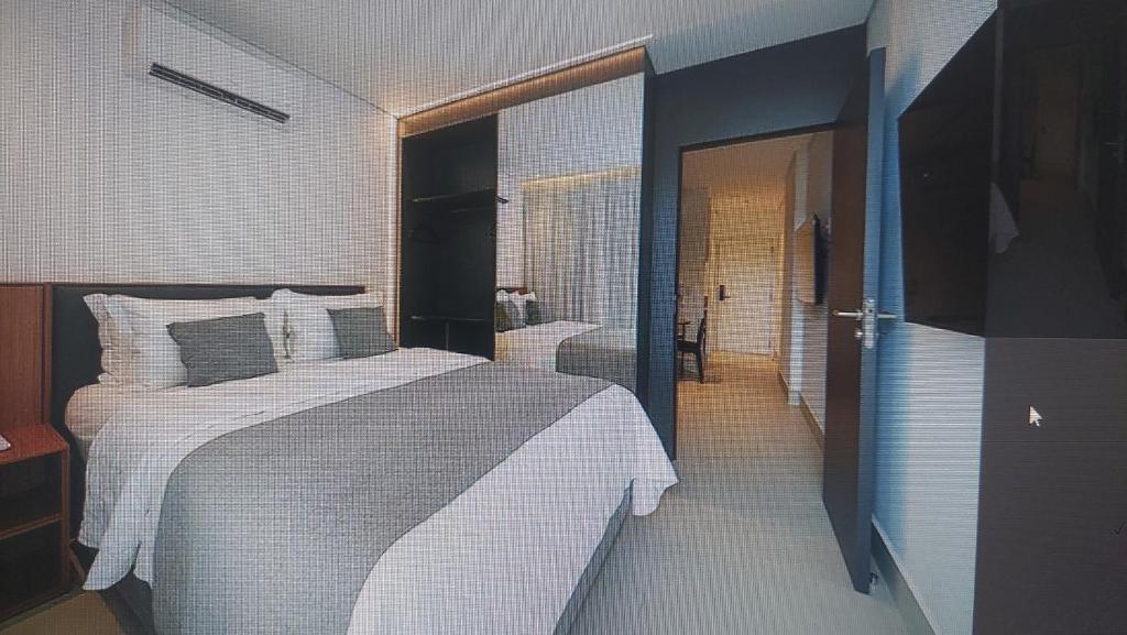 En eller flere senge i et værelse på Porto 2 Life Resort - Apartamento para 4 pessoas