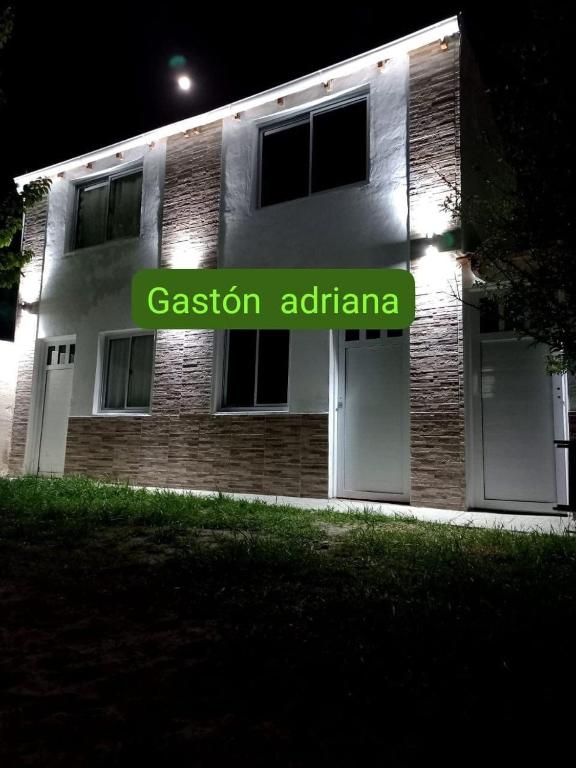 a building with a sign that reads passion ardarna at Mi casa querida in Mar de Ajó