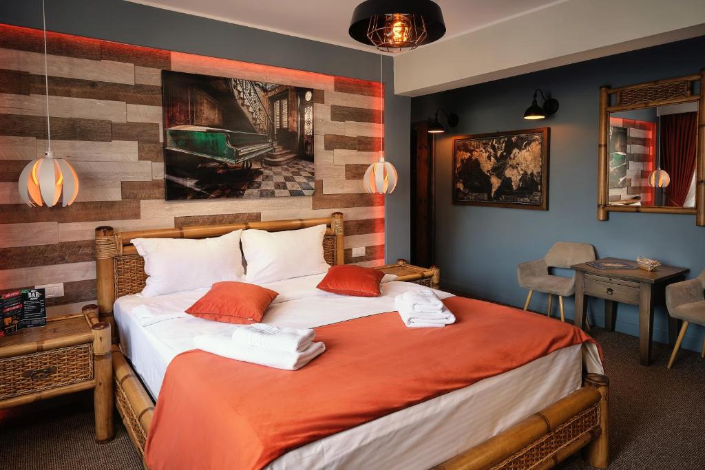 En eller flere senge i et værelse på Independentei-Spiridon Central Apartaments